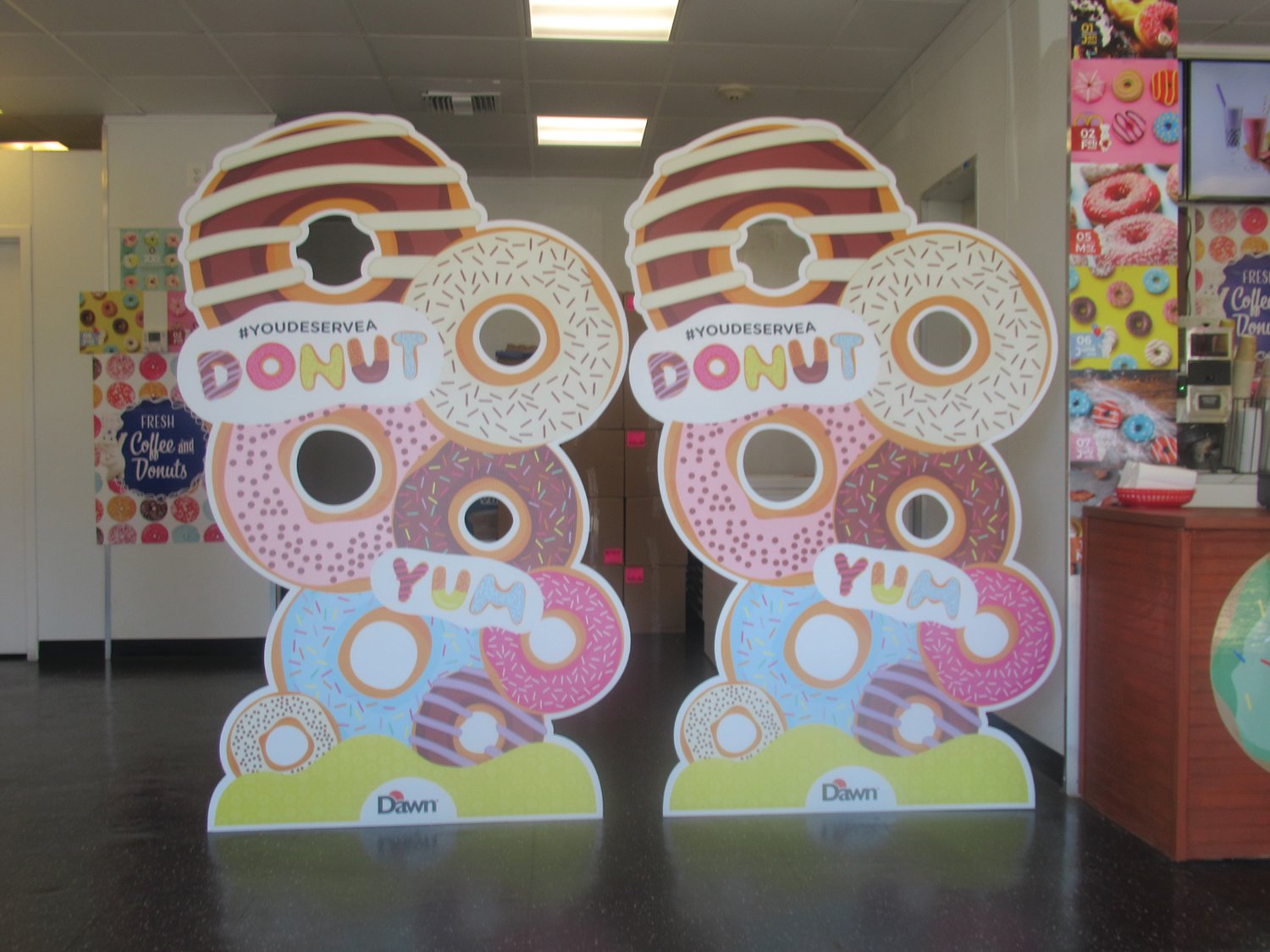 TEMPTING TREATS: This special sign inside Rhode Island Homemade Donuts is part of the colorful collections inside Johnston’s newest business.